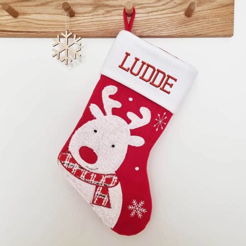 Red and white Christmas stocking with name and reindeer