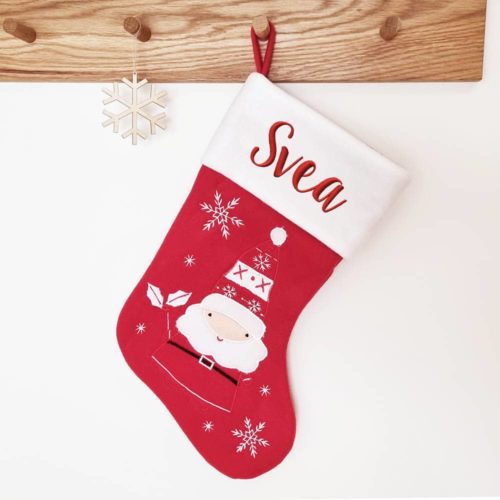 Christmas stocking with Santa's name and snowflakes