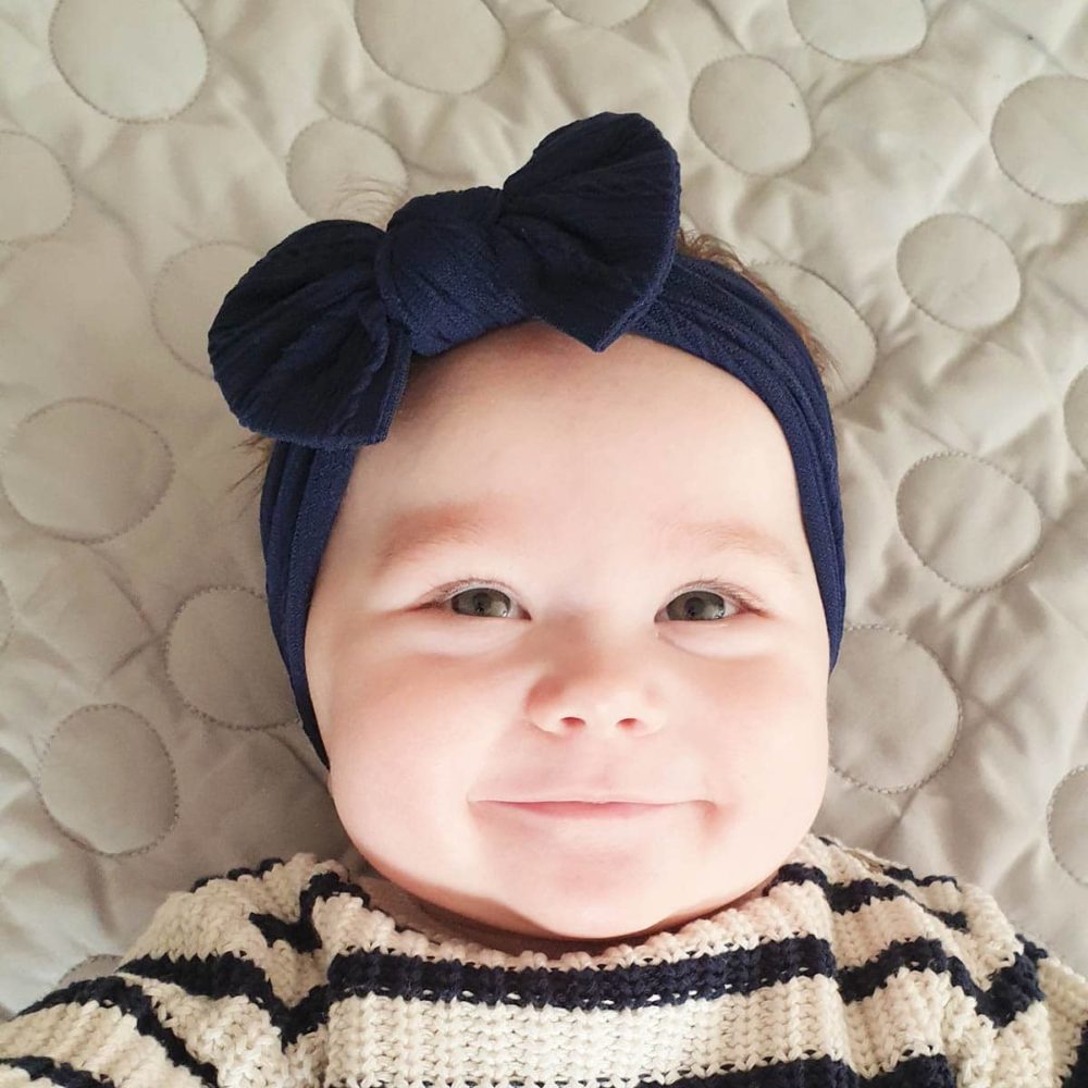 Navy blue hair band on a cute baby